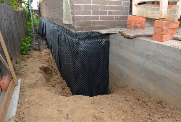 SJ Waterproofing Pros technician performing targeted Exterior Waterproofing assessment in Arcola, IN